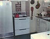 Refrigerator, stove and kitchen cabinets