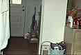 Terry cloth robe hanging on bedroom door (left side of photo)